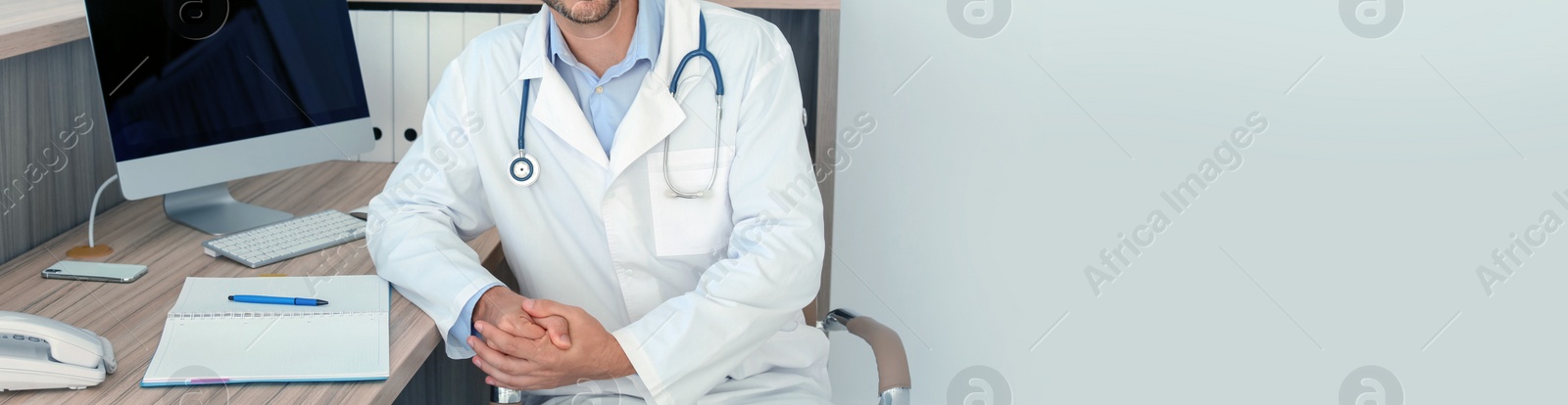 Image of Doctor in uniform at workplace in clinic, space for text. Banner design