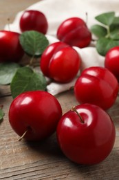 Fresh ripe cherry plums on wooden table, closeup