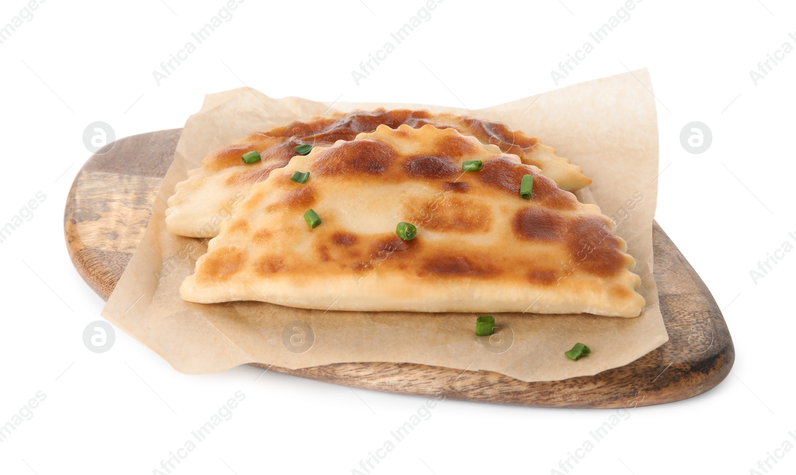 Photo of Board with delicious fried chebureki isolated on white