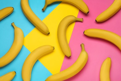 Photo of Ripe yellow bananas on color background, flat lay