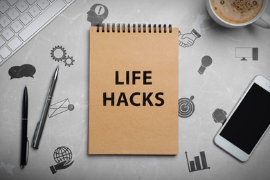 Image of Notebook with words Life Hacks, drawings and stationery on grey table, top view