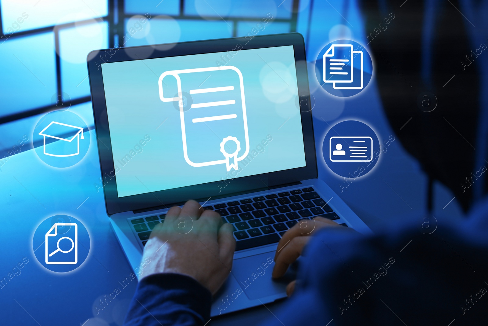 Image of Online learning concept. Man using laptop with diploma illustration on screen surrounded by different icons, closeup