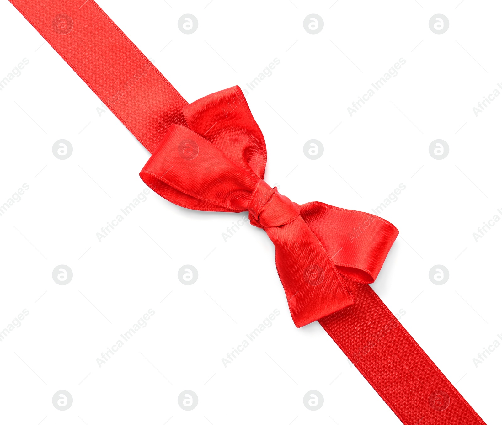 Photo of Red ribbon with bow on white background, top view