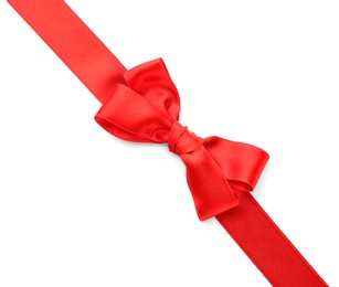 Red ribbon with bow on white background, top view