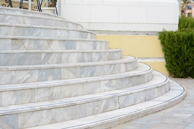 Photo of View of stone tiled stairs outdoors. Entrance design