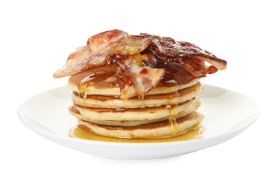 Delicious pancakes with maple syrup and fried bacon on white background