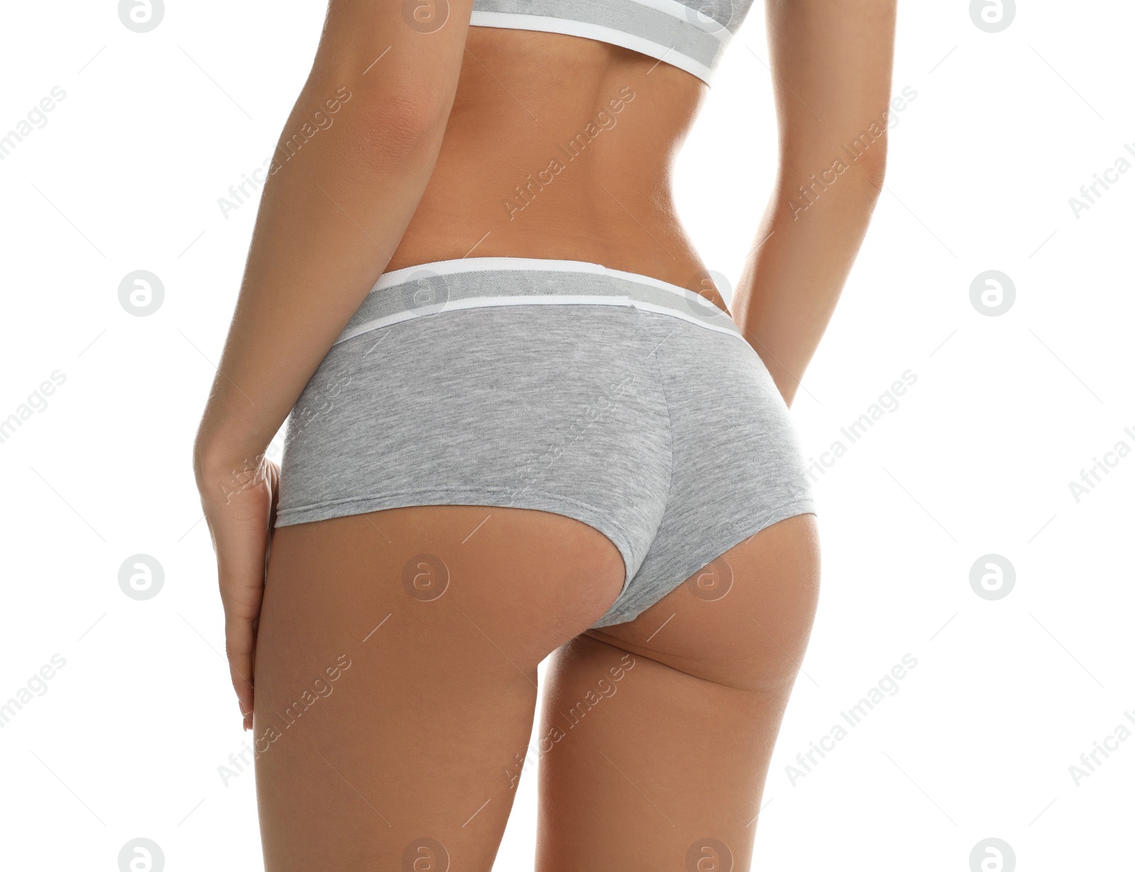 Photo of Young woman in grey sportive underwear isolated on white, closeup