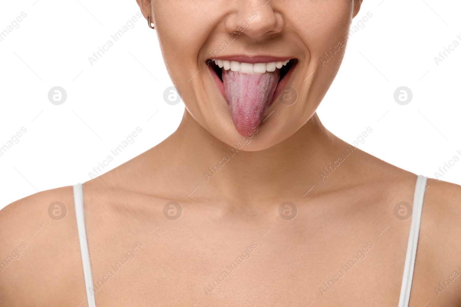 Photo of Happy young woman showing her tongue on white background, closeup