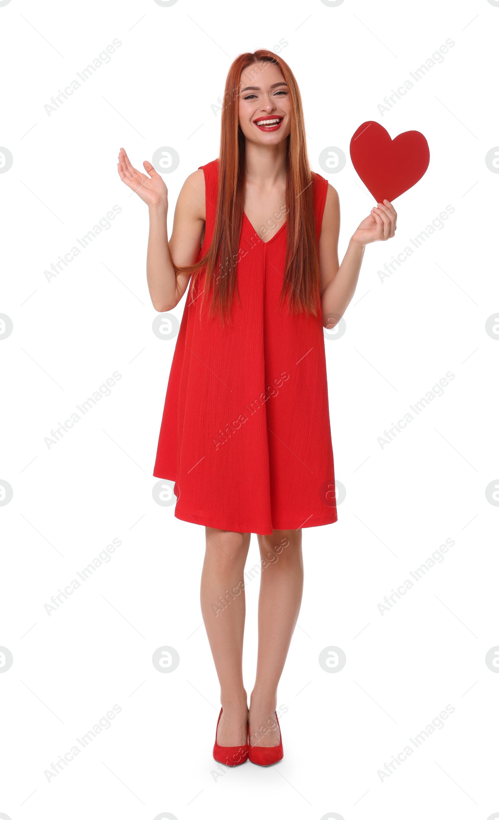 Photo of Young woman in red dress with paper heart on white background