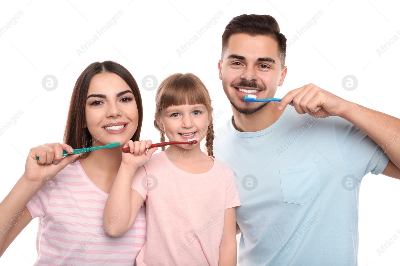 Photo of Little girl and her parents brushing teeth together on white background