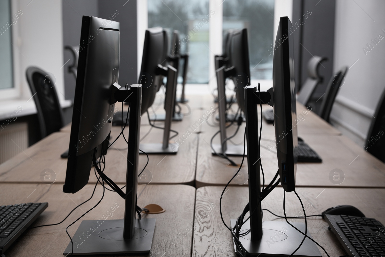 Photo of Many modern computers in open space office