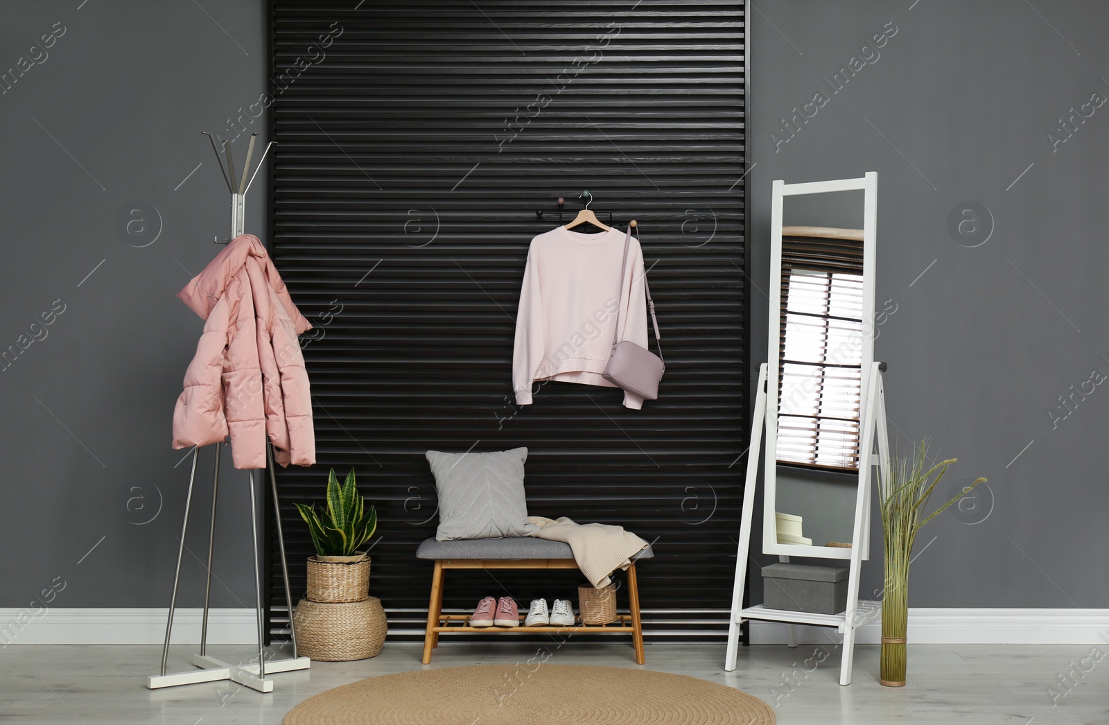 Photo of Hallway interior with stylish furniture, clothes and accessories