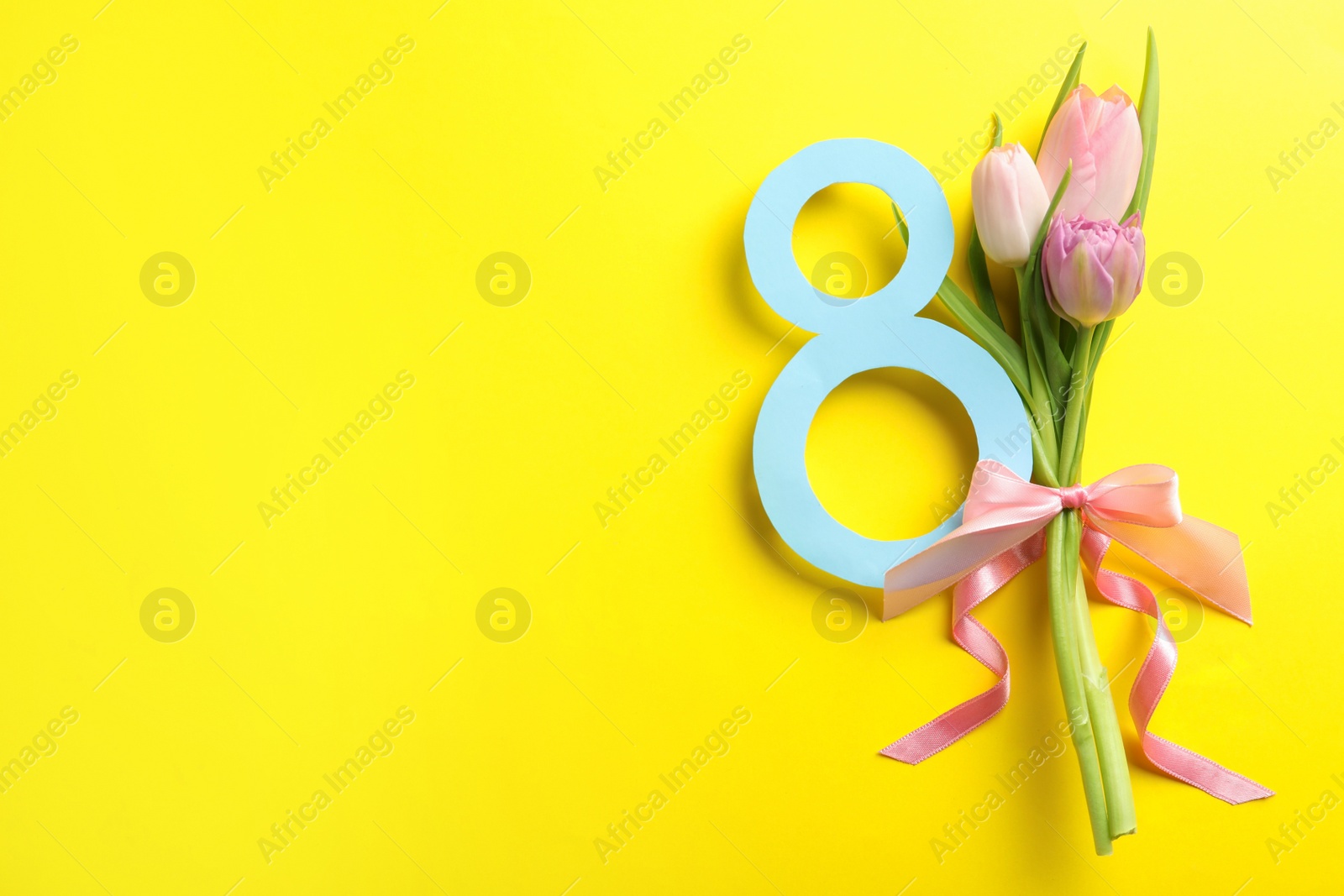Photo of 8 March card design with tulips and space for text on yellow background, flat lay. International Women's Day