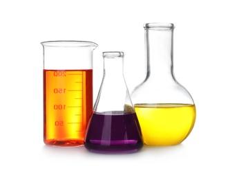 Photo of Laboratory glassware with color liquids on white background