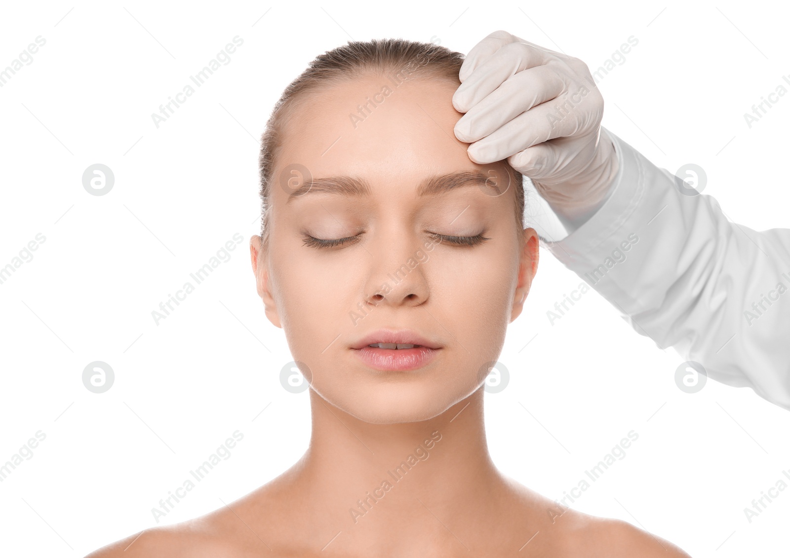 Photo of Doctor examining young woman face before cosmetic surgery on white background