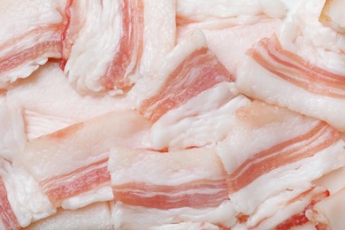 Photo of Slices of tasty salt pork as background, top view