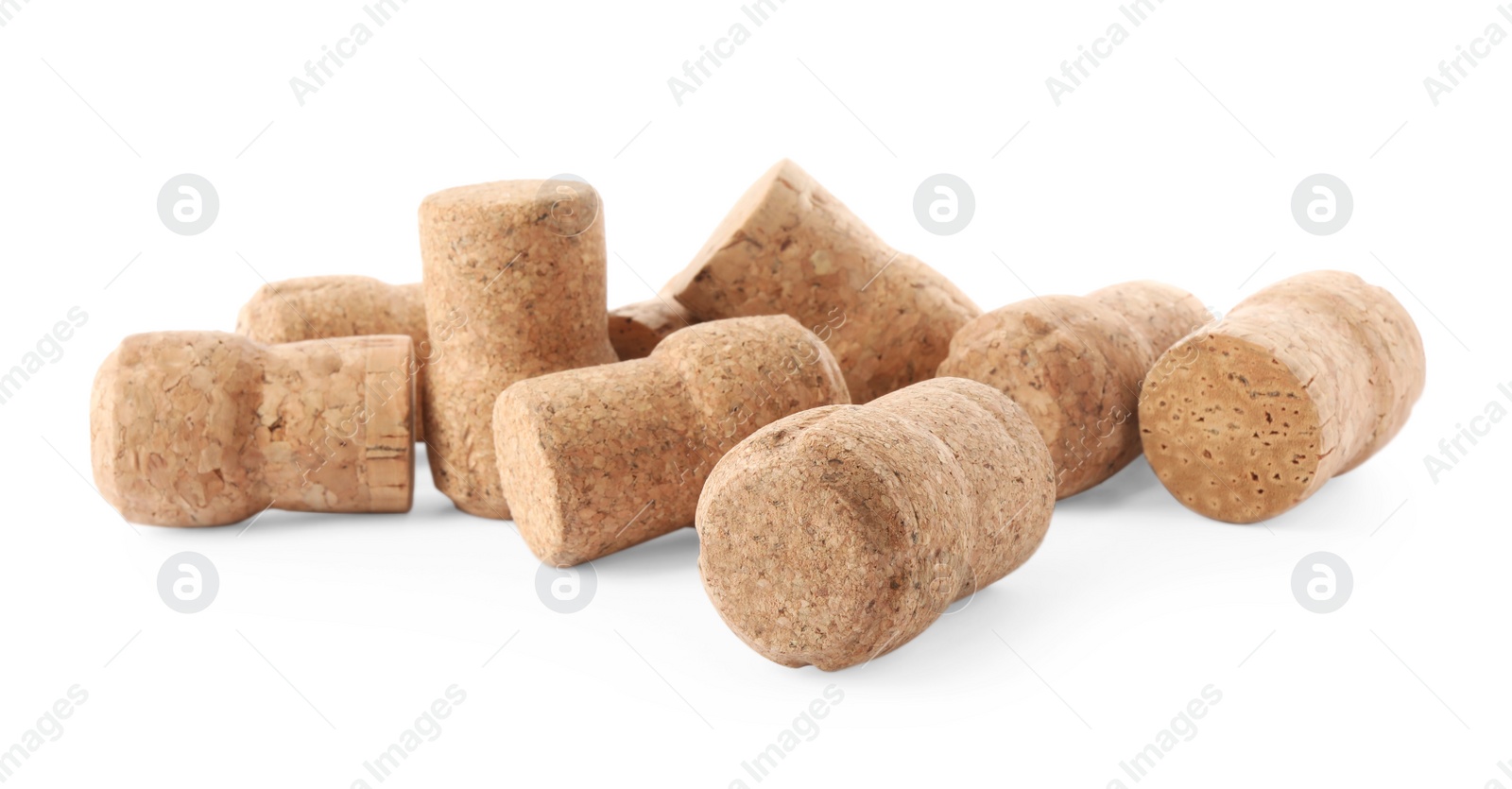 Photo of Many sparkling wine corks on white background