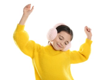 Cute girl wearing stylish earmuffs on white background