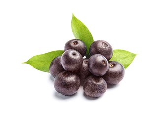 Fresh acai berries with leaves on white background