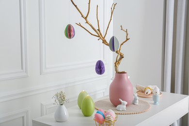 Photo of Beautiful festive composition with Easter decor on white table indoors