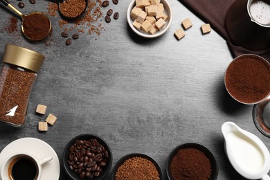Photo of Flat lay composition with beans, instant and ground coffee on grey table. Space for text