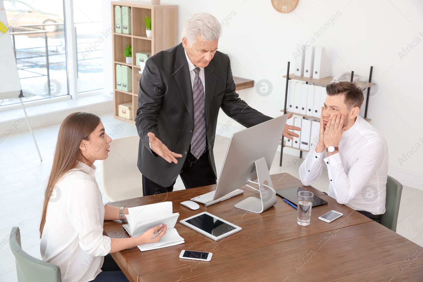 Photo of Office employees having argument at workplace