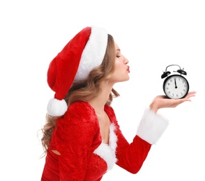 Beautiful Santa girl with alarm clock on white background. Christmas celebration