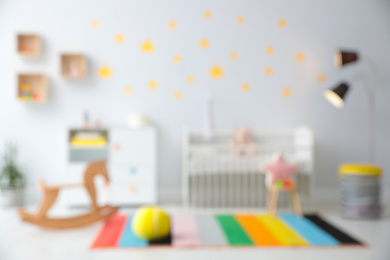 Blurred view of stylish baby room interior