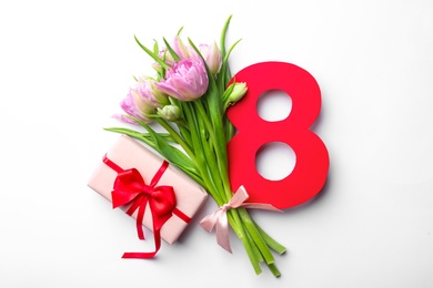 Photo of 8 March greeting card design with tulips and gift on white background, top view