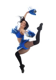 Beautiful cheerleader in costume holding pom poms on white background