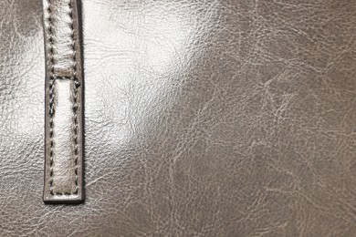 Photo of Natural leather with seams as background, top view