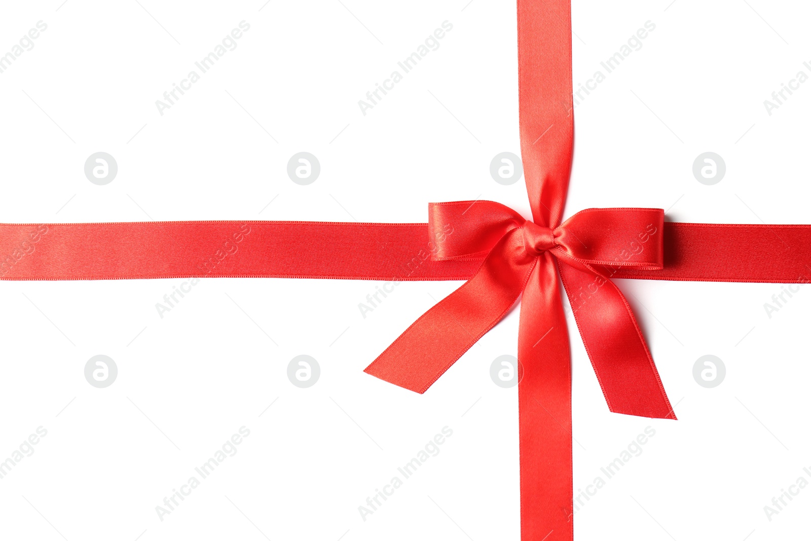 Photo of Red ribbon with bow on white background. Festive decoration