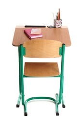 Wooden school desk with stationery on white background