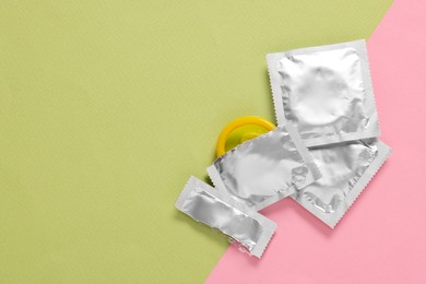 Photo of Condoms on color background, top view with space for text. Safe sex