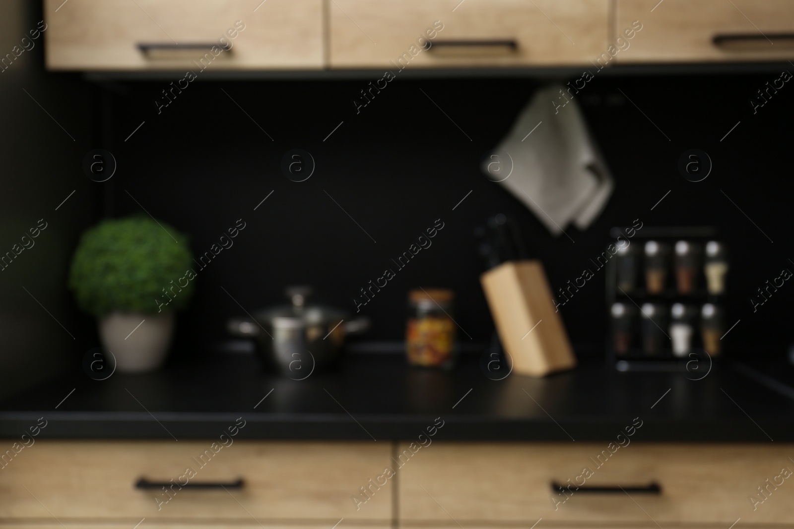 Photo of Blurred view of kitchen interior with modern furniture