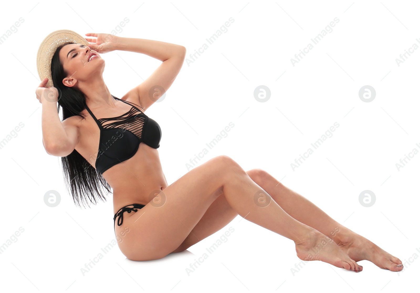 Photo of Beautiful young woman in black bikini with hat on white background