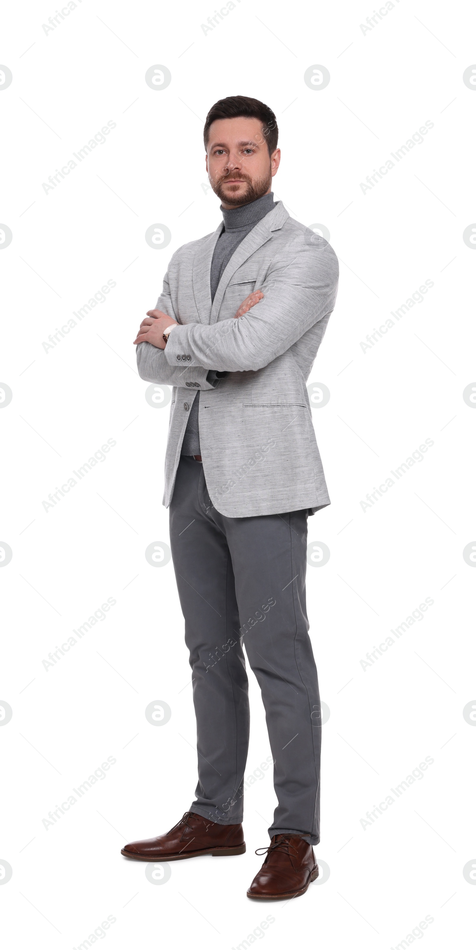 Photo of Handsome bearded businessman in suit on white background