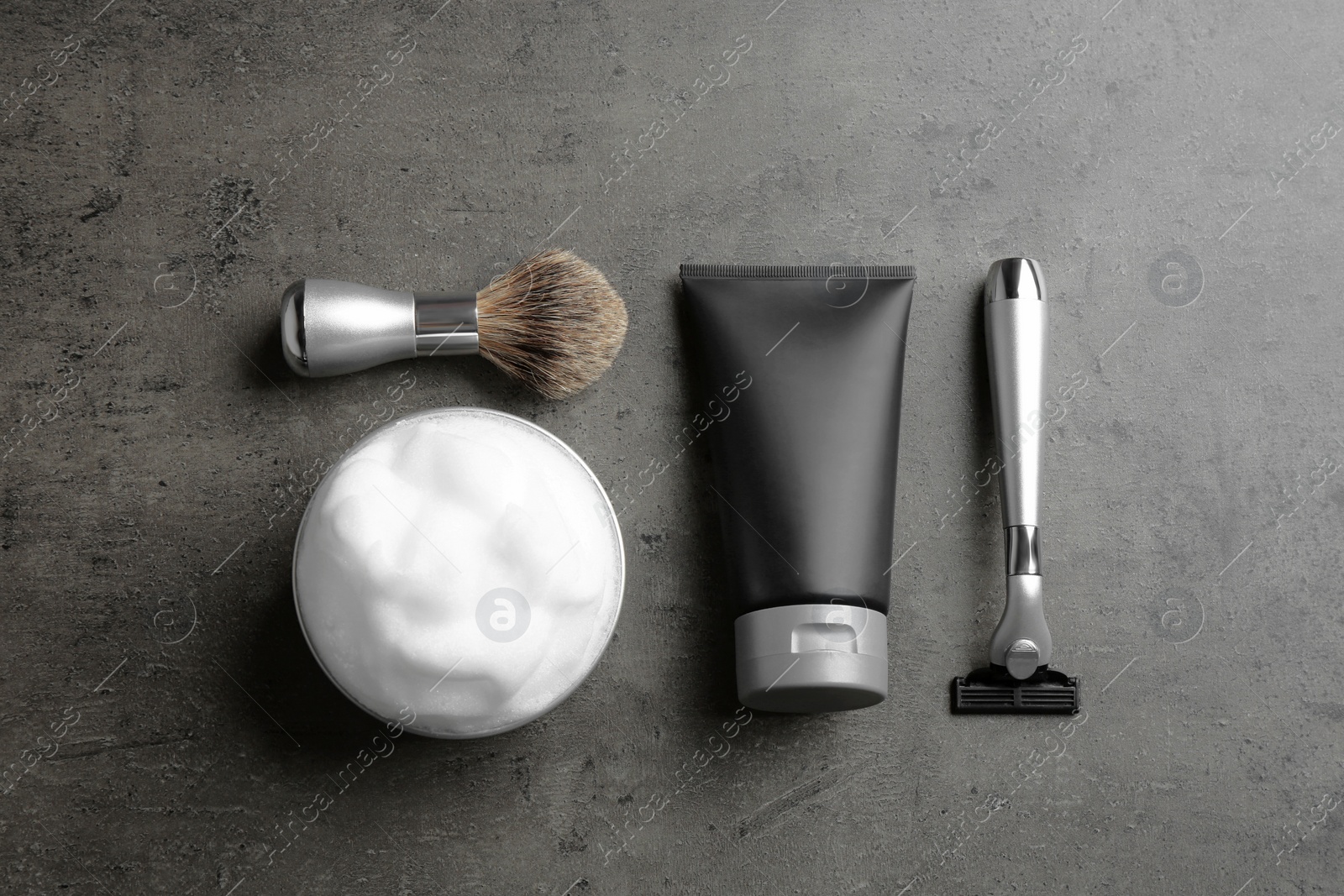 Photo of Flat lay composition with men's cosmetic products on grey background. Space for design