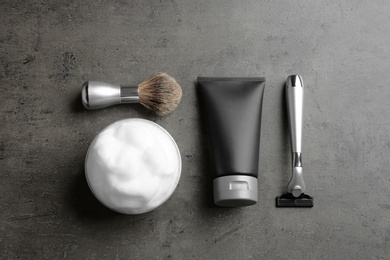 Photo of Flat lay composition with men's cosmetic products on grey background. Space for design