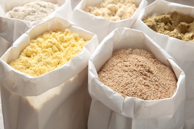 Different types of flour in paper bags