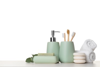 Bath accessories. Different personal care products and eucalyptus branch on table against white background. Space for text