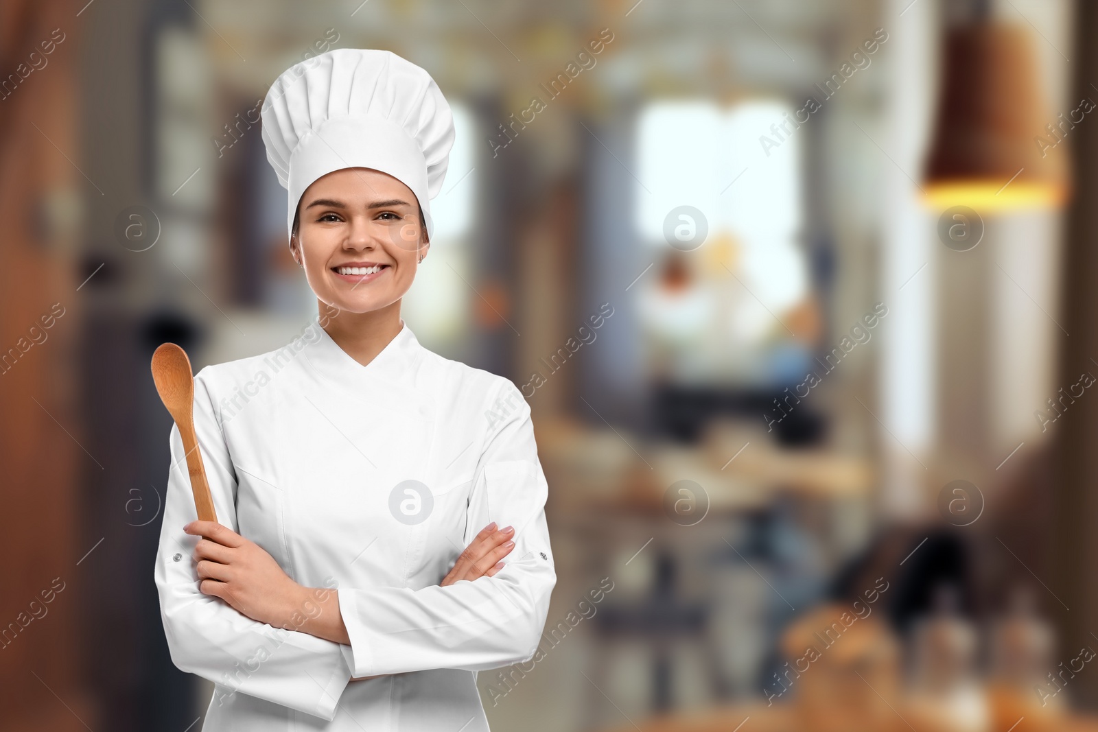 Image of Smiling chef in uniform at restaurant, space for text