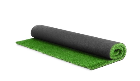 Rolled artificial grass carpet on white background. Exterior element