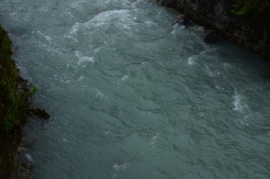 Beautiful mountain stream flowing outdoors, closeup view