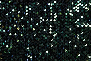 Photo of Beautiful dark sequin fabric as background, top view