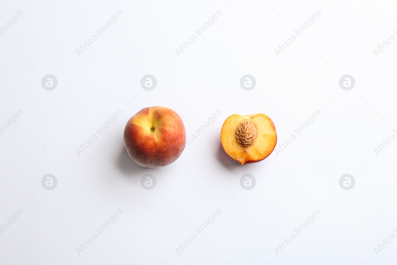 Photo of Composition with fresh peaches on white background, top view