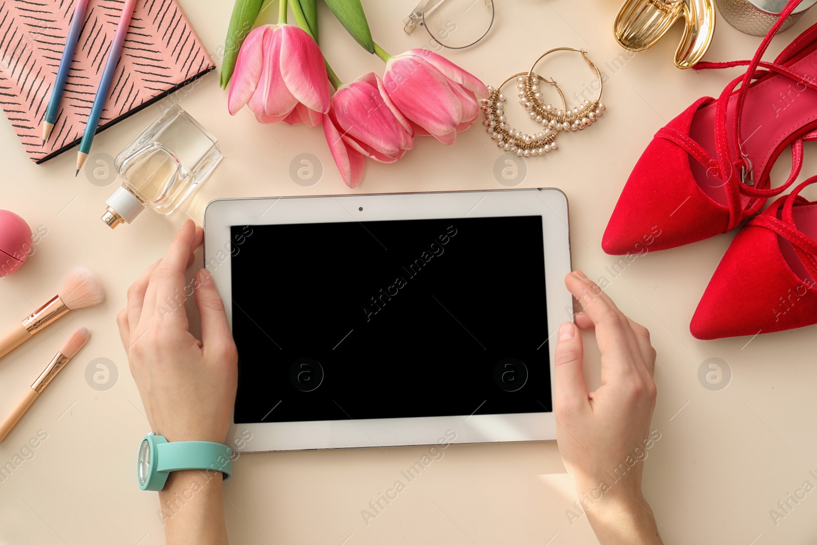 Photo of Beauty blogger with tablet at table, top view