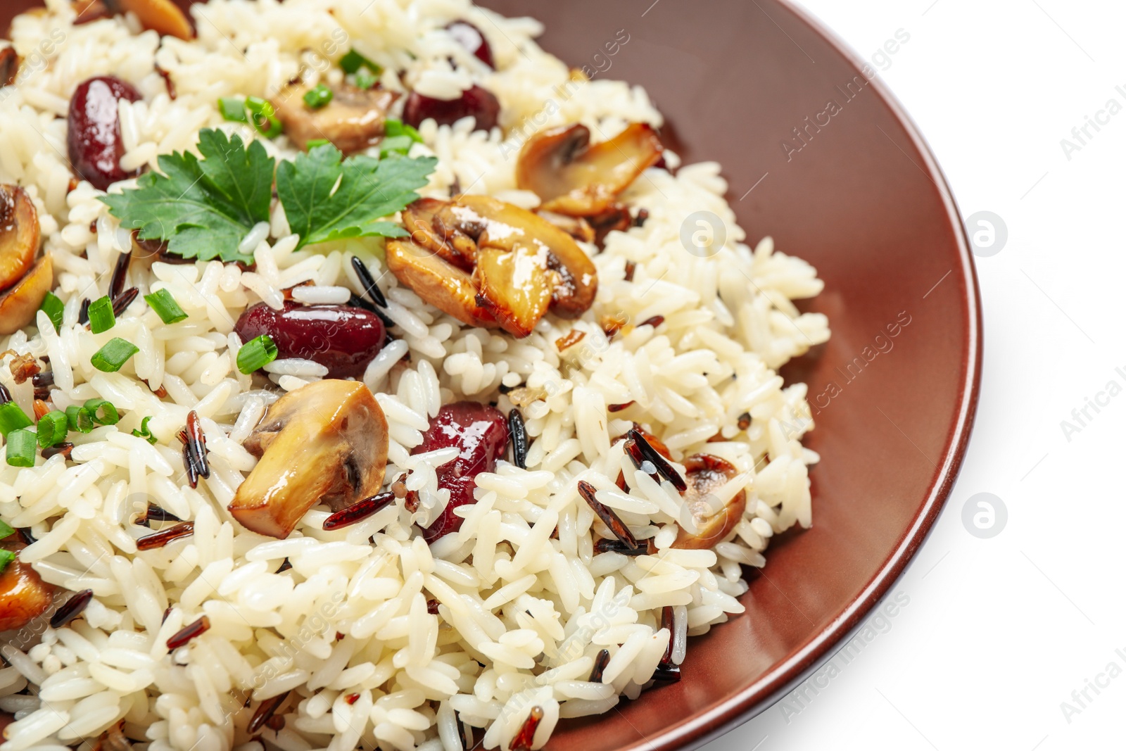 Photo of Delicious rice pilaf with mushrooms and beans isolated on white, closeup