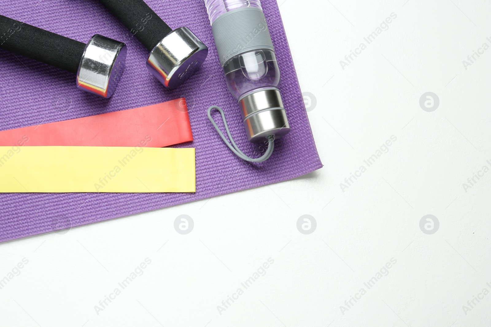 Photo of Flat lay composition with fitness elastic bands on white background