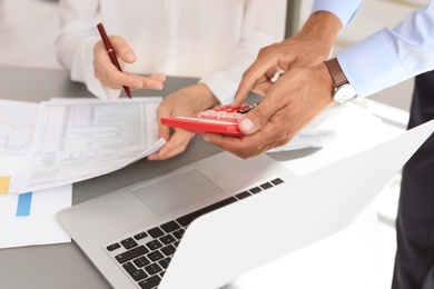 Photo of Tax accountants working with documents at table